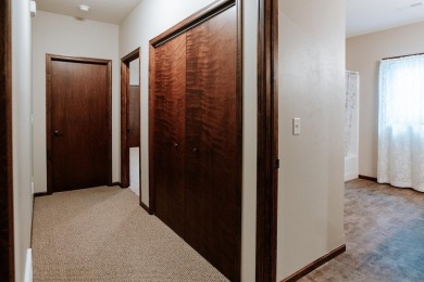 This beautifully maintained ranch home sits on over half an acre on The Ridge Golf Club in Iowa - for sale on GolfHomes.com, golf home, golf lot