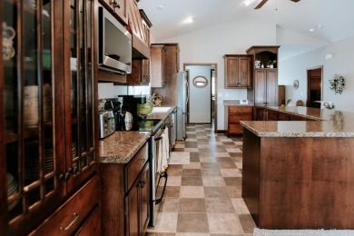 This beautifully maintained ranch home sits on over half an acre on The Ridge Golf Club in Iowa - for sale on GolfHomes.com, golf home, golf lot