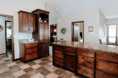 This beautifully maintained ranch home sits on over half an acre on The Ridge Golf Club in Iowa - for sale on GolfHomes.com, golf home, golf lot