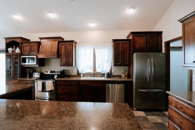 This beautifully maintained ranch home sits on over half an acre on The Ridge Golf Club in Iowa - for sale on GolfHomes.com, golf home, golf lot