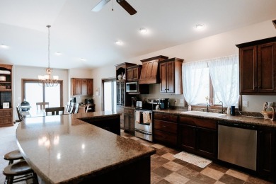 This beautifully maintained ranch home sits on over half an acre on The Ridge Golf Club in Iowa - for sale on GolfHomes.com, golf home, golf lot
