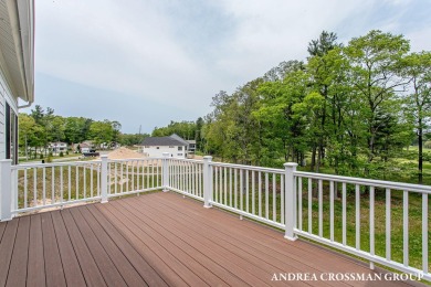 Welcome to your dream home nestled within the serene landscape on Muskegon Country Club in Michigan - for sale on GolfHomes.com, golf home, golf lot