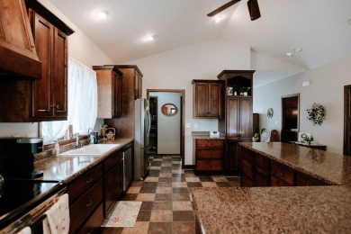 This beautifully maintained ranch home sits on over half an acre on The Ridge Golf Club in Iowa - for sale on GolfHomes.com, golf home, golf lot