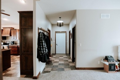 This beautifully maintained ranch home sits on over half an acre on The Ridge Golf Club in Iowa - for sale on GolfHomes.com, golf home, golf lot