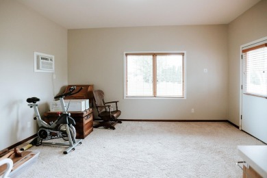 This beautifully maintained ranch home sits on over half an acre on The Ridge Golf Club in Iowa - for sale on GolfHomes.com, golf home, golf lot