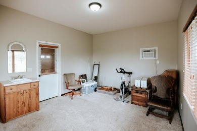 This beautifully maintained ranch home sits on over half an acre on The Ridge Golf Club in Iowa - for sale on GolfHomes.com, golf home, golf lot