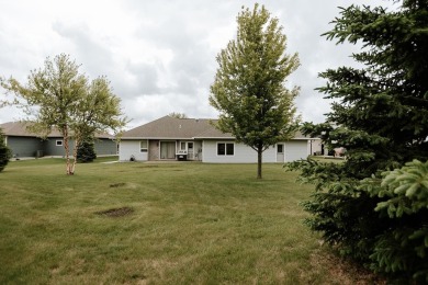 This beautifully maintained ranch home sits on over half an acre on The Ridge Golf Club in Iowa - for sale on GolfHomes.com, golf home, golf lot