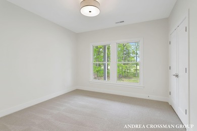 Welcome to your dream home nestled within the serene landscape on Muskegon Country Club in Michigan - for sale on GolfHomes.com, golf home, golf lot