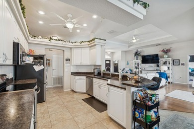 Experience timeless design, modern upgrades, and effortless on Oak Hills Country Club in Florida - for sale on GolfHomes.com, golf home, golf lot