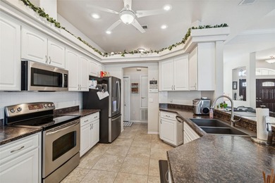 Experience timeless design, modern upgrades, and effortless on Oak Hills Country Club in Florida - for sale on GolfHomes.com, golf home, golf lot