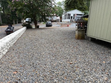Plenty of space inside and out with this great unit. Double lots on The Tillery Tradition Country Club in North Carolina - for sale on GolfHomes.com, golf home, golf lot