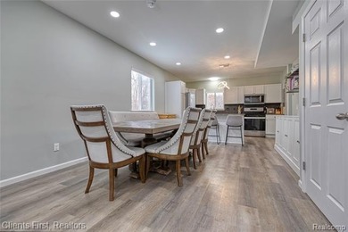 Welcome home to this fully remodeled and beautifully upgraded on Rush Lake Hills Golf Club in Michigan - for sale on GolfHomes.com, golf home, golf lot