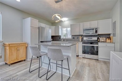 Welcome home to this fully remodeled and beautifully upgraded on Rush Lake Hills Golf Club in Michigan - for sale on GolfHomes.com, golf home, golf lot