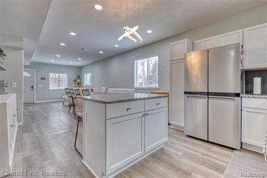 Welcome home to this fully remodeled and beautifully upgraded on Rush Lake Hills Golf Club in Michigan - for sale on GolfHomes.com, golf home, golf lot