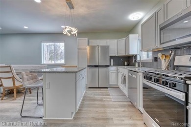 Welcome home to this fully remodeled and beautifully upgraded on Rush Lake Hills Golf Club in Michigan - for sale on GolfHomes.com, golf home, golf lot