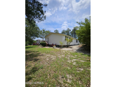 Welcome to 111 Ryder Cup Blvd! This charming 3-bedroom, 2-bath on Bluff Golf Links in North Carolina - for sale on GolfHomes.com, golf home, golf lot