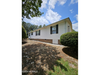 Welcome to 111 Ryder Cup Blvd! This charming 3-bedroom, 2-bath on Bluff Golf Links in North Carolina - for sale on GolfHomes.com, golf home, golf lot