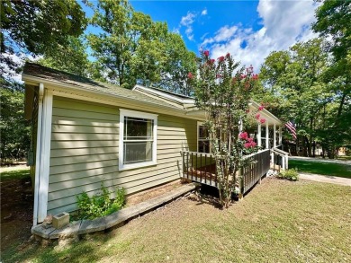 Adorable single-level home on nearly an acre of rare flat land on Holiday Island Executive Golf Course in Arkansas - for sale on GolfHomes.com, golf home, golf lot
