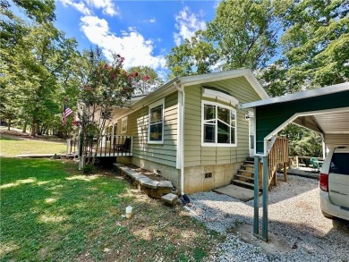 Adorable single-level home on nearly an acre of rare flat land on Holiday Island Executive Golf Course in Arkansas - for sale on GolfHomes.com, golf home, golf lot