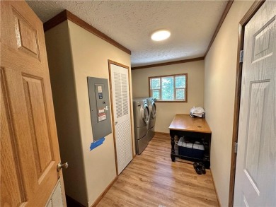 Adorable single-level home on nearly an acre of rare flat land on Holiday Island Executive Golf Course in Arkansas - for sale on GolfHomes.com, golf home, golf lot