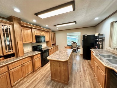 Adorable single-level home on nearly an acre of rare flat land on Holiday Island Executive Golf Course in Arkansas - for sale on GolfHomes.com, golf home, golf lot