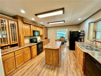 Adorable single-level home on nearly an acre of rare flat land on Holiday Island Executive Golf Course in Arkansas - for sale on GolfHomes.com, golf home, golf lot