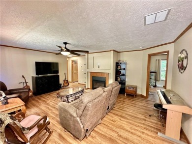 Adorable single-level home on nearly an acre of rare flat land on Holiday Island Executive Golf Course in Arkansas - for sale on GolfHomes.com, golf home, golf lot