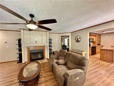 Adorable single-level home on nearly an acre of rare flat land on Holiday Island Executive Golf Course in Arkansas - for sale on GolfHomes.com, golf home, golf lot