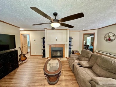 Adorable single-level home on nearly an acre of rare flat land on Holiday Island Executive Golf Course in Arkansas - for sale on GolfHomes.com, golf home, golf lot