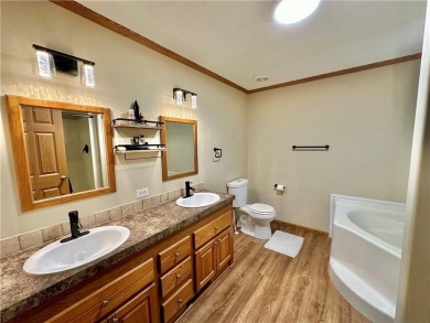 Adorable single-level home on nearly an acre of rare flat land on Holiday Island Executive Golf Course in Arkansas - for sale on GolfHomes.com, golf home, golf lot