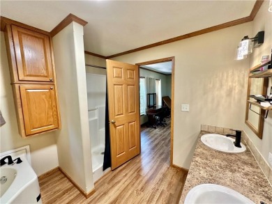 Adorable single-level home on nearly an acre of rare flat land on Holiday Island Executive Golf Course in Arkansas - for sale on GolfHomes.com, golf home, golf lot