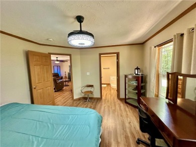 Adorable single-level home on nearly an acre of rare flat land on Holiday Island Executive Golf Course in Arkansas - for sale on GolfHomes.com, golf home, golf lot