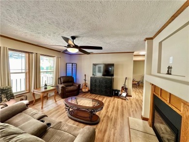 Adorable single-level home on nearly an acre of rare flat land on Holiday Island Executive Golf Course in Arkansas - for sale on GolfHomes.com, golf home, golf lot