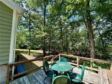 Adorable single-level home on nearly an acre of rare flat land on Holiday Island Executive Golf Course in Arkansas - for sale on GolfHomes.com, golf home, golf lot