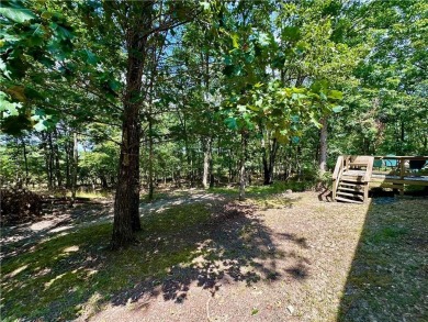 Adorable single-level home on nearly an acre of rare flat land on Holiday Island Executive Golf Course in Arkansas - for sale on GolfHomes.com, golf home, golf lot