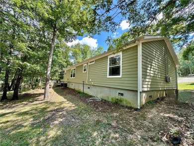 Adorable single-level home on nearly an acre of rare flat land on Holiday Island Executive Golf Course in Arkansas - for sale on GolfHomes.com, golf home, golf lot