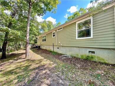 Adorable single-level home on nearly an acre of rare flat land on Holiday Island Executive Golf Course in Arkansas - for sale on GolfHomes.com, golf home, golf lot
