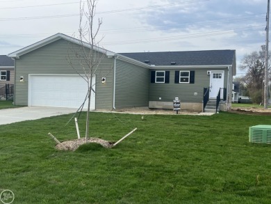 Brand new great room ranch backing to Kearsley Park and Golf on Kearsley Lake Golf Course in Michigan - for sale on GolfHomes.com, golf home, golf lot