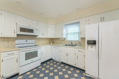 Freshly painted 3-bedroom, den & 3-bath end-unit townhouse on Panther Valley Golf and Country Club in New Jersey - for sale on GolfHomes.com, golf home, golf lot