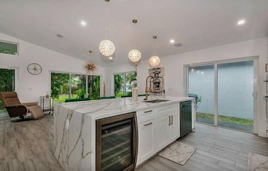 Fall in love instantly with this beautifully renovated lakefront on Grand Palms Hotel and Golf Resort in Florida - for sale on GolfHomes.com, golf home, golf lot