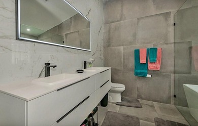 Fall in love instantly with this beautifully renovated lakefront on Grand Palms Hotel and Golf Resort in Florida - for sale on GolfHomes.com, golf home, golf lot