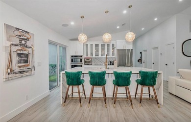 Fall in love instantly with this beautifully renovated lakefront on Grand Palms Hotel and Golf Resort in Florida - for sale on GolfHomes.com, golf home, golf lot