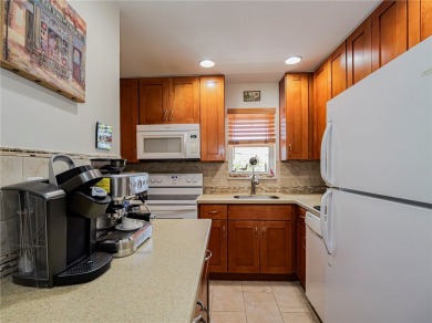 Completely redone with tile floors throughout, updated kitchen on Monterey Yacht and Country Club in Florida - for sale on GolfHomes.com, golf home, golf lot