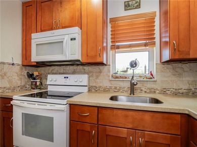 Completely redone with tile floors throughout, updated kitchen on Monterey Yacht and Country Club in Florida - for sale on GolfHomes.com, golf home, golf lot