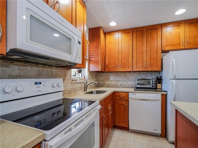 Completely redone with tile floors throughout, updated kitchen on Monterey Yacht and Country Club in Florida - for sale on GolfHomes.com, golf home, golf lot