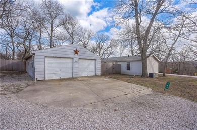 Nestled on a large corner lot, this well-maintained 3-bed on Linn Valley Lakes - Deer Trace Golf Course in Kansas - for sale on GolfHomes.com, golf home, golf lot