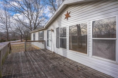 Nestled on a large corner lot, this well-maintained 3-bed on Linn Valley Lakes - Deer Trace Golf Course in Kansas - for sale on GolfHomes.com, golf home, golf lot