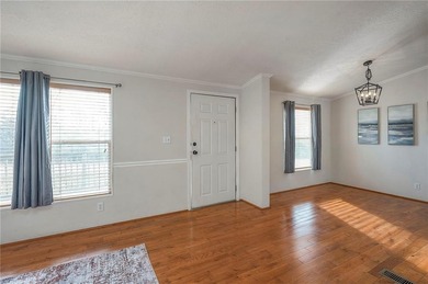 Nestled on a large corner lot, this well-maintained 3-bed on Linn Valley Lakes - Deer Trace Golf Course in Kansas - for sale on GolfHomes.com, golf home, golf lot