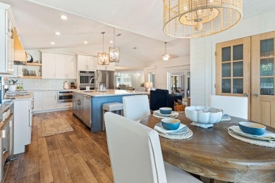 Discover luxury coastal living at its finest in this fully on Apollo Beach Golf and Sea Club in Florida - for sale on GolfHomes.com, golf home, golf lot