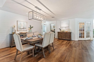 Discover luxury coastal living at its finest in this fully on Apollo Beach Golf and Sea Club in Florida - for sale on GolfHomes.com, golf home, golf lot